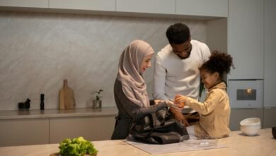 Happy multiethnic family near table in kitchen