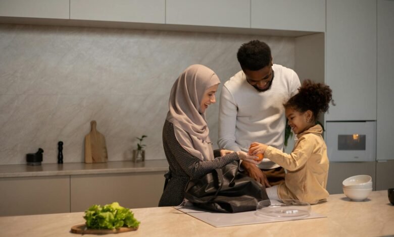 Happy multiethnic family near table in kitchen