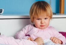 boy wearing pink long-sleeved top