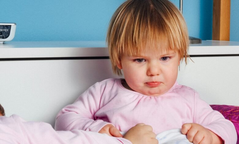 boy wearing pink long-sleeved top