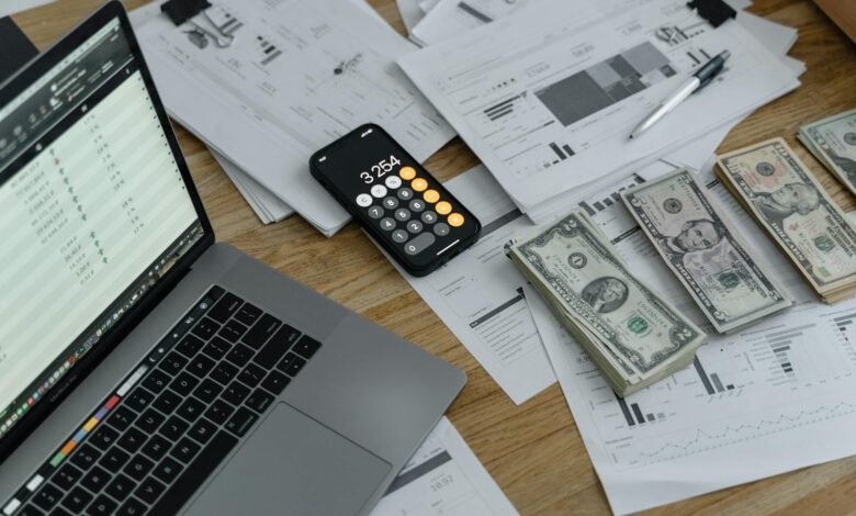 Banknotes and Calculator on Table